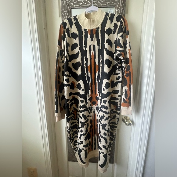 An abstract design creates a fun motif create this sweater dress. - Picture 4 of 5